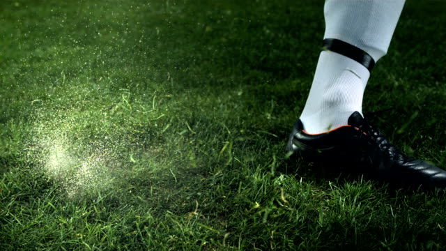HD Super Slow-Mo: Soccer Player Kicking A Ball