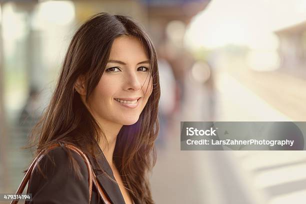 Smiling Brunette Woman Stock Photo - Download Image Now - Train - Vehicle, Commuter, Mature Adult