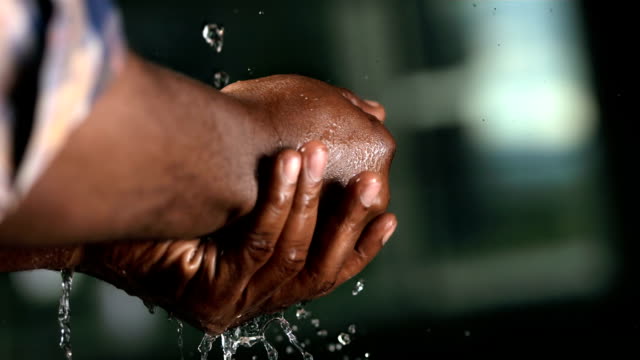 HD Super Slow-Mo: Worker Washing His Hands