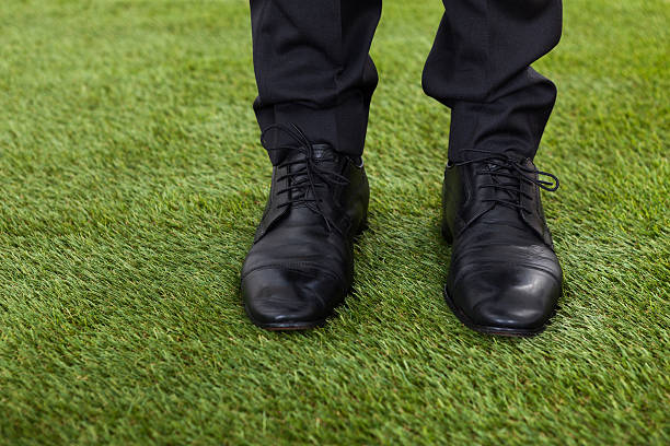 istock Businessman Standing On Green Grass 479318834