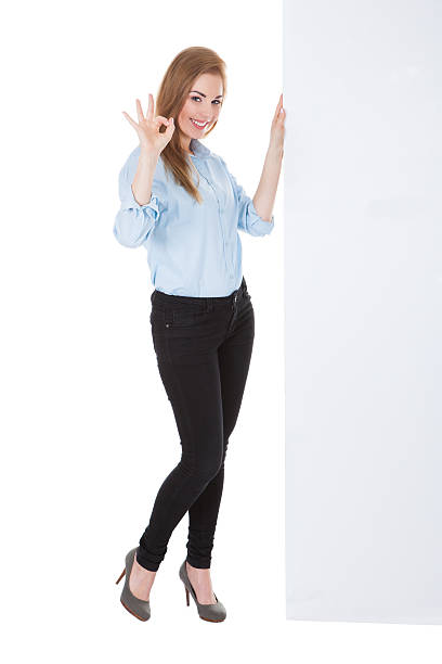 istock Smiling Woman Holding Placard 479319120