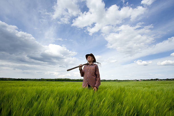 Angry farmer threatening with pitchfork.