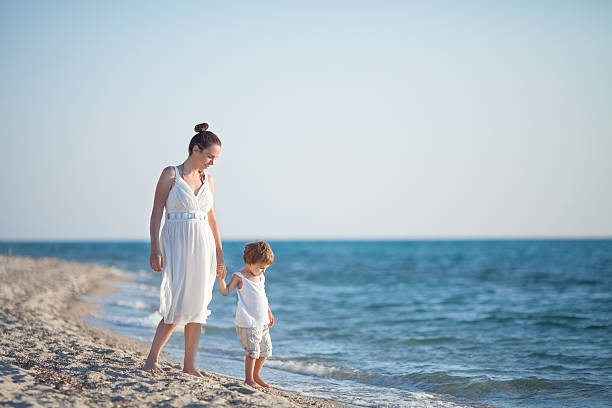 istock Family Beach Walk 479325164