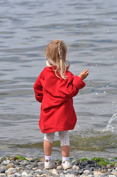 istock Girl skipping rocks 479328965