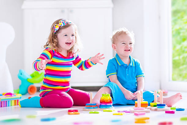 istock Adorable kids playing with wooden blocks 479329672