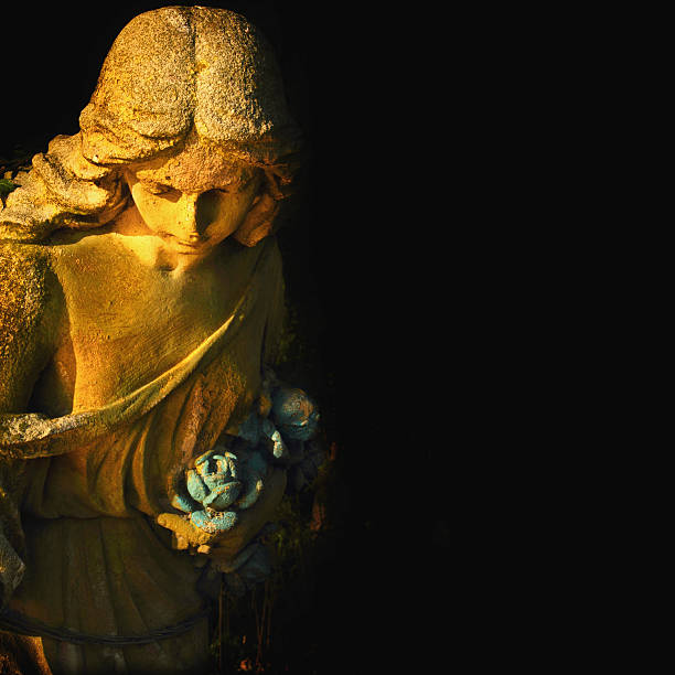 istock golden angel on the black background (antique statue) 479332900