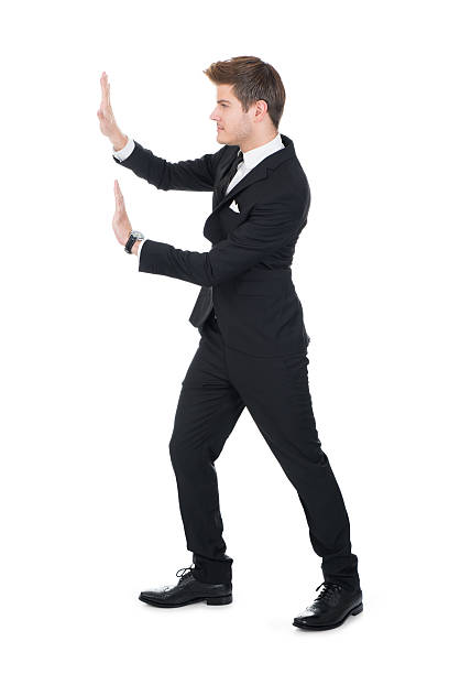istock Businessman Pushing Invisible Wall 479335510