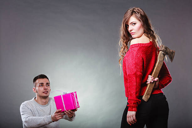 istock Trusting guy giving present to misleading girl 479336700