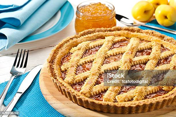 Homemade Italian Crostata Served On Blue Table Stock Photo - Download Image Now - Apricot, Linzertorte, Preserves