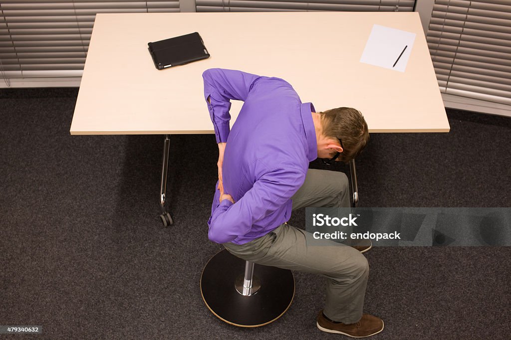 man with lower back pain in office work 2015 Stock Photo