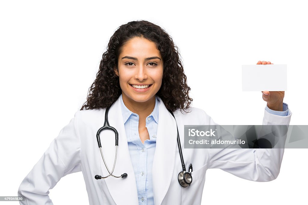 Female doctor showing business card Female doctor showing an empty business card and smiling isolated over white background 20-24 Years Stock Photo