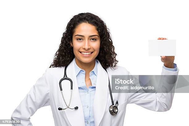 Female Doctor Showing Business Card Stock Photo - Download Image Now - 20-24 Years, 20-29 Years, 2015