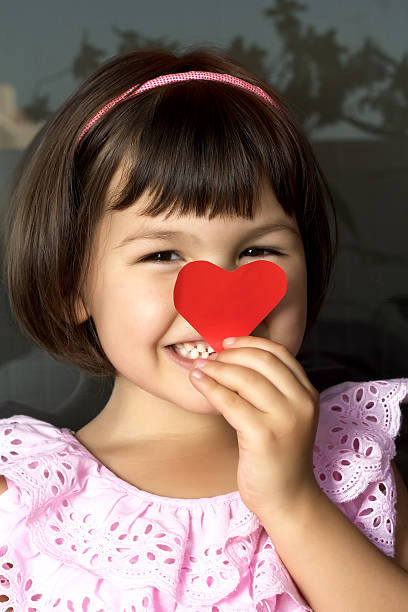 istock Little girl and red hearts. 479345331