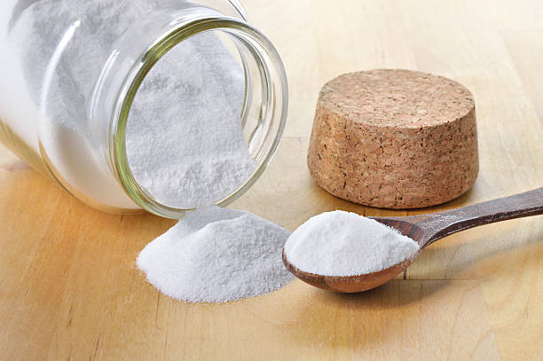 Close-up of baking soda in a glass jar. Close-up of baking soda in a glass jar. Bicarbonate of soda. sodium stock pictures, royalty-free photos & images