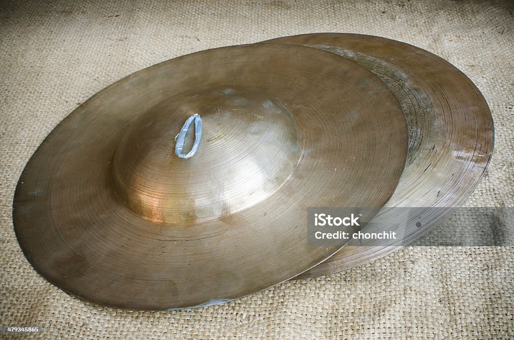 Thai Cymbal Thai Tradition medium size cymbal on brownish sack Cultures Stock Photo