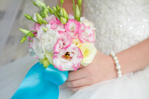 istock Bride holding wedding bouquet close up 479346089
