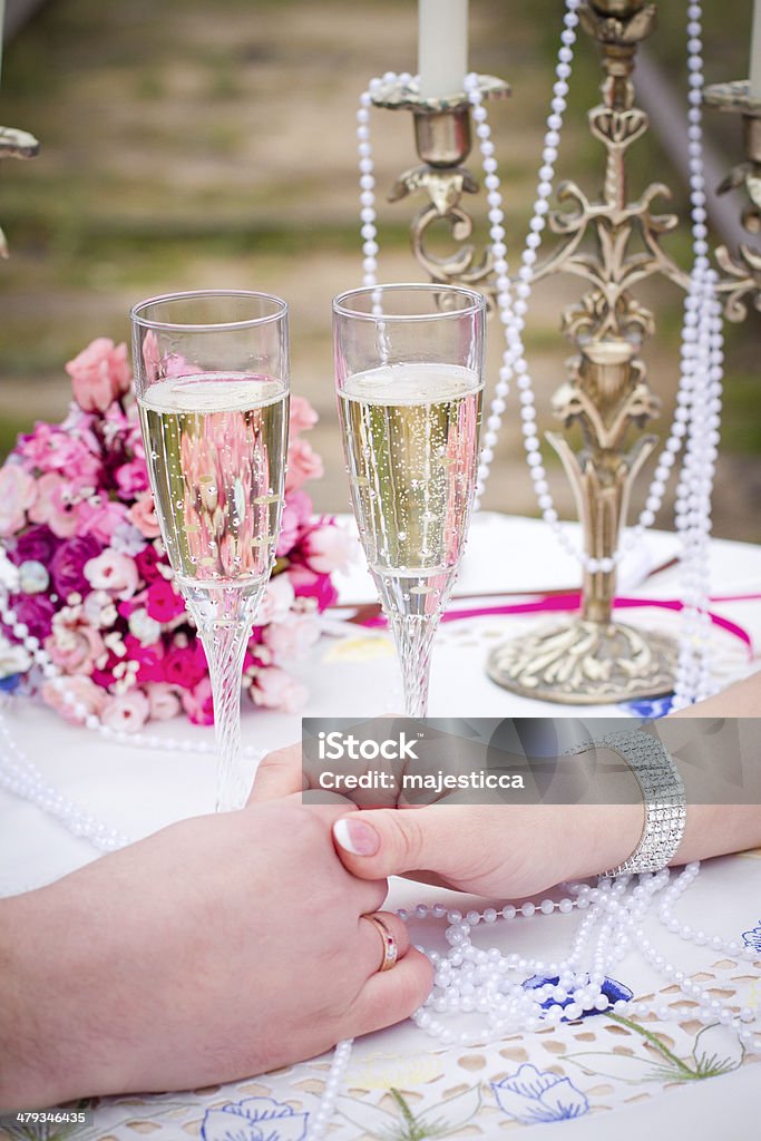 couple holding hands at  table couple holding hands at  table outdoors Adult Stock Photo