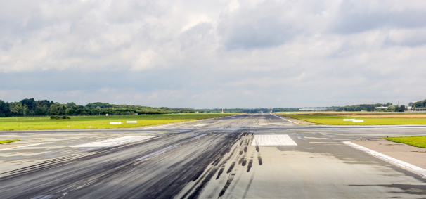detail of runway with pattern of wheels in the touch down zone