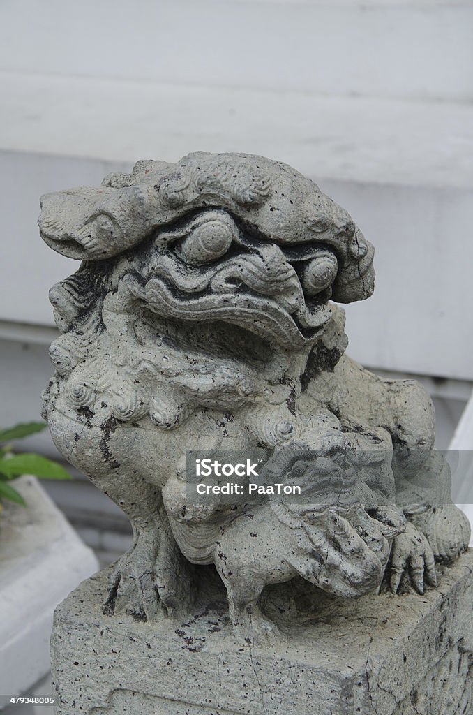 Lion Statue at Wat Pho Lion Statue as door guardian at The Temple of Reclining Buddha, Bangkok, Thailand Architecture Stock Photo