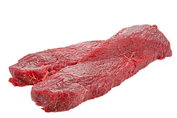 istock Two slices of beef on white background 479354403
