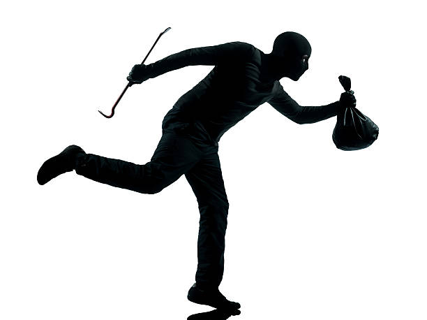 istock man thief criminal running silhouette 479357487