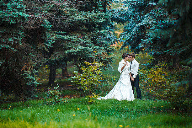 istock bride and groom walk in nature 479357631