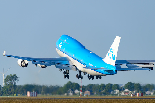 Amsterdam,  The Netherlands - June 10, 2015: KLM Boeing 747 Jumbojet airplane taking off from Schiphol Airport near Amsterdam in The Netherlands.