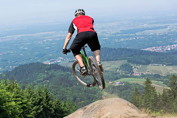 istock Mountain bike rider jumping precipice 479358174