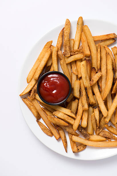 istock french fries and ketchup in a white plate 479360884