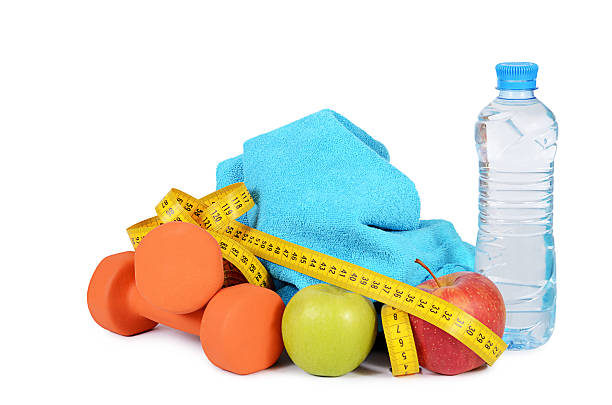 istock Measuring tape with dumbbells isolated 479361678