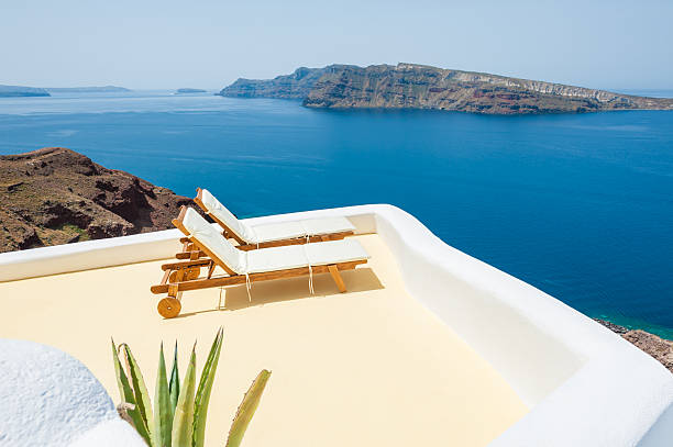 istock Sunbeds on the beach. Santorini island, Greece 479362874