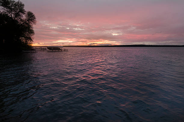istock Sunset Over A Lake In Minnesota With Single Boat 479371852