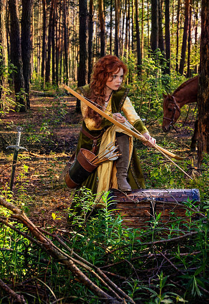 istock woman warrior armed with a bow on horseback 479372166