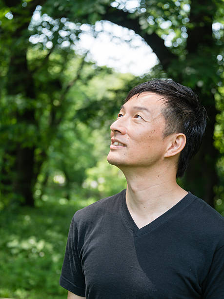 istock Young man looking up into space and smiling 479372706