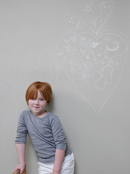 istock Girl Standing Below Chalk Drawing On Wall 479372835