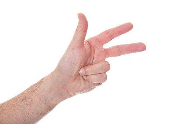 istock Close-up Of Human Hand Gesturing Number Three 479377998