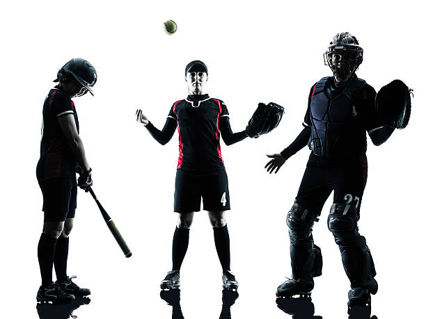 istock women playing softball players silhouette isolated 479378472