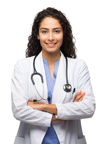 Portrait of female doctor standing with arms crossed and smiling isolated over white background