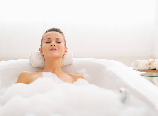 istock young woman relaxing in bathtub 479380299