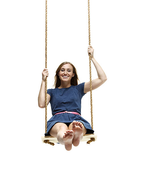 istock Happy young woman on rope swing 479381761