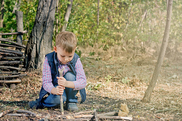 istock Cute Boy Playing at the Woodland During Autumn 479383464