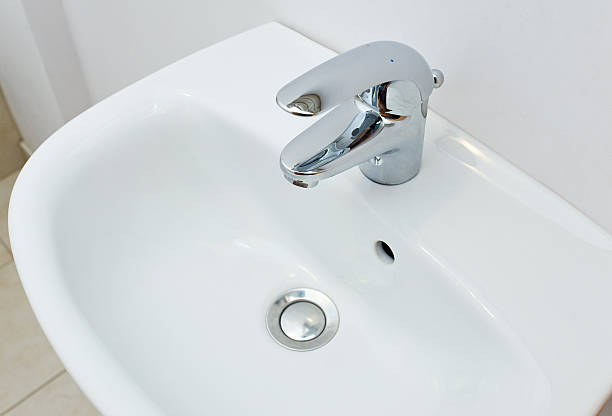 istock Bathroom interior with white sink and silver faucet 479388549
