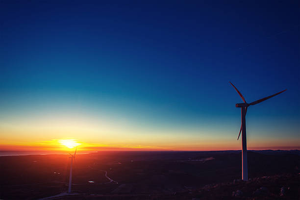 istock Solar wind turbines at sunset. 479391724