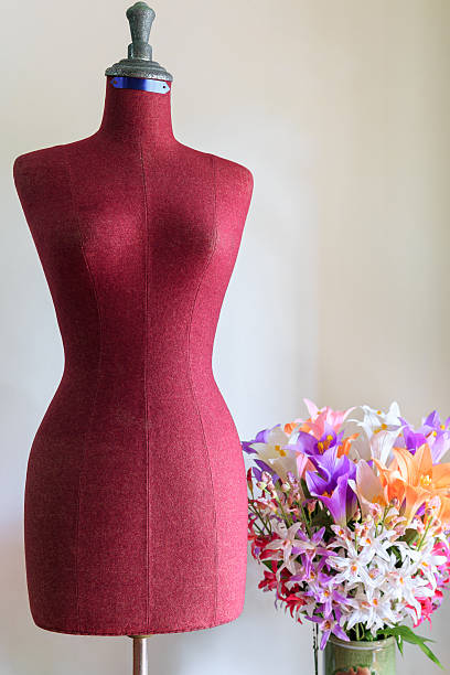istock Clothing mannequin with flowers vase 479392506