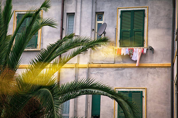 Tuscan lifestyle. Italy Typical apartment building in North Tuscany. Laundry hanging outside. Romantic :-) parabol stock pictures, royalty-free photos & images
