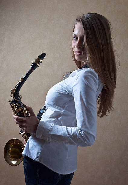 istock woman with saxophone 479393138