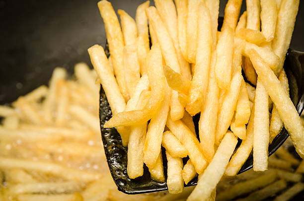istock French fries in a hot pan. 479403405