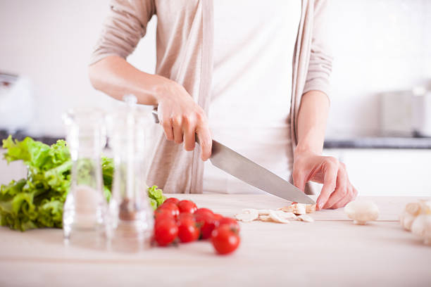 istock Woman cutting mushrooms 479405636