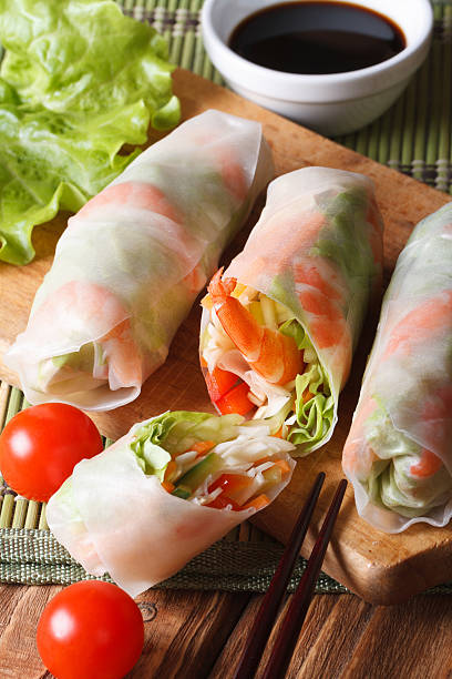 istock sliced the spring rolls with shrimp and vegetables closeup. Vertical 479406190