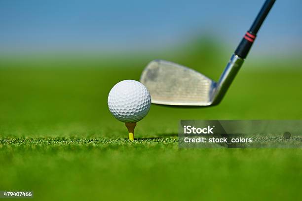 Golf Club Hitting Ball On Course Stock Photo - Download Image Now - 2015, Blue, Close To